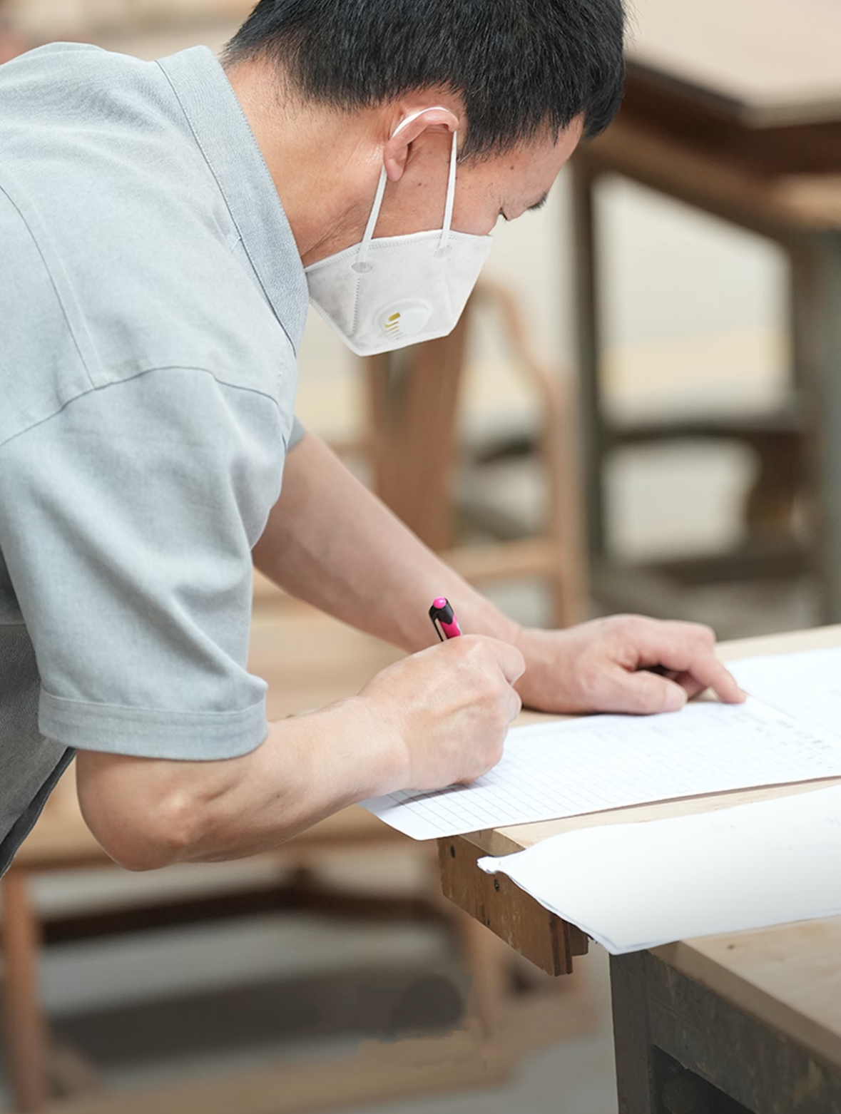 Craftsman checking drawings - QC on site